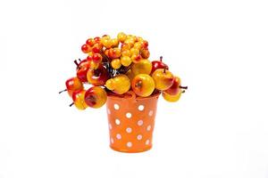 aluminum ice bucket laid in wait for use. stainless multi-colored bucket with red apples photo