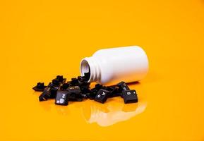 keyboard button in glass in jar in bucket on orange background photo