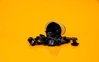 keyboard button in glass in jar in bucket on orange background photo