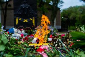 The flame of the eternal flame of the monument of the Second World War. A symbol of the solemn memory of the people about the fallen heroes. photo
