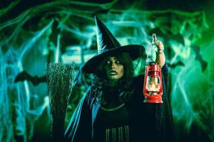 Witch With Lighted Lantern In Magic Fog photo