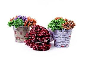 aluminum ice bucket laid in wait for use. stainless multi-colored bucket with green blue flowers photo
