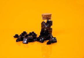 keyboard button in glass in jar in bucket on orange background photo