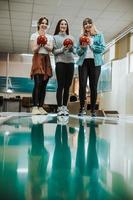 Female Friends Bowling Together photo