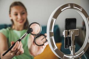 Teenager Girl Making A Video Blog On A Smartphone At Her Home photo