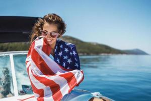 Woman Wrapped In US National Flag Spending Day On Private Yacht photo