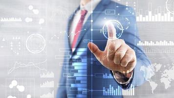 Presses a virtual button. Business intelligence. Diagram, Graph, Stock Trading, Investment dashboard, transparent blurred background photo