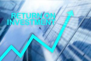 ROI - Return on investment. Stock trading and financial growth concept on blurred business center background. photo