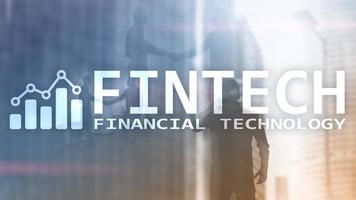 FINTECH - Financial technology, global business and information Internet communication technology. Skyscrapers background. Hi-tech business concept. photo