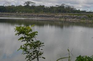 Panoramic view in Malang, Indonesia with mountains and lake photo