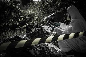 Asian scientist wear Chemical protection suit check danger chemical,working at dangerous zone photo