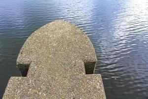 Concrete and metal architecture on the dike and harbor Germany. photo