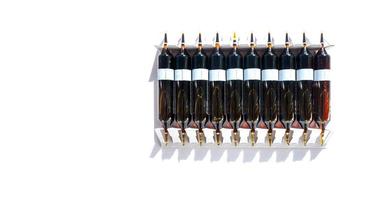 Group of ampoules with a transparent medicine in medical laboratory. lot of ampoules on light background. banner with copy space photo