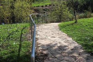 Pedestrian road in the city park on the seashore. photo