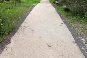 Pedestrian road in the city park on the seashore. photo