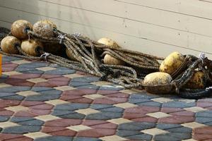 Hemp rope with buoys on the city beach photo