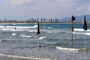 Hemp rope with buoys on the city beach photo