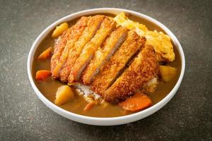 curry rice with fried pork cutlet and creamy omelet photo