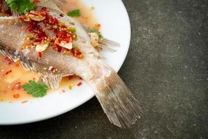 Steamed grouper fish with lime and chillies photo