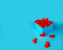 Blue box with red hearts on a blue background. Gift. photo