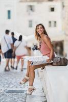 Woman Having Fun While Exploring A Foreign City On A Summer Vacation photo