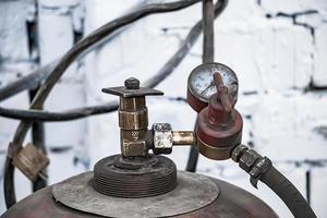 Old gas cylinders for welding and cutting. Rusty propane and oxy photo