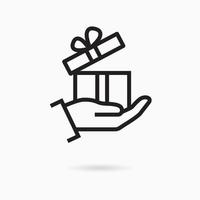 Gift box in hand line icon on white background. Vector illustration.