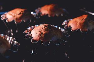 Fresh baked homemade muffins in metal cups photo