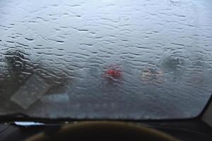 Blurred image of a raindrops on the windshield. photo