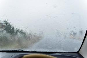 Blurred image of a raindrops on the windshield. photo