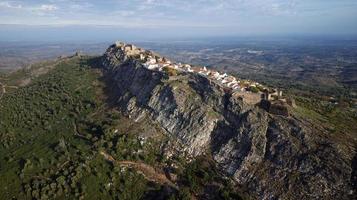 Aerial drone view of Marvao, Historic Villages of Portugal. Castle and old town inside of a fortified wall on the cliff of a mountain. Rural tourism. Holidays. Best destinations in the world. photo