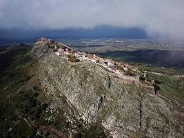 Aerial drone view of Marvao, Historic Villages of Portugal. Castle and old town inside of a fortified wall on the cliff of a mountain. Rural tourism. Holidays. Best destinations in the world. photo