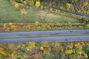 British Motorways, roads and highways passing through countryside, aerial view with drone's camera. photo