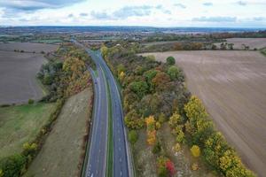 British Motorways, roads and highways passing through countryside of England. aerial view with drone's camera photo