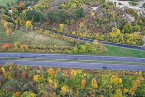 British Motorways, roads and highways passing through countryside, aerial view with drone's camera. photo