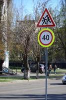 Road sign with the number 40 and the image of the children who run across the road photo
