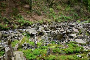 A strange composition of small mountain rocks. imitation of ancient buildings on a reduced scale photo