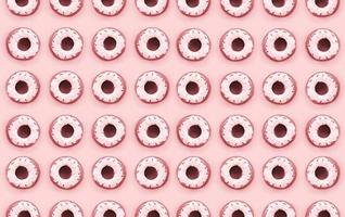 Many small plastic donuts lies on a pastel colorful background. Flat lay minimal pattern. Top view photo