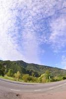 Asphalt road in the mountainous terrain in the morning photo