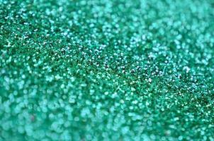 A huge amount of decorative sequins. Background image with shiny bokeh lights from small elements photo