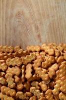 Many salted crackers on a cutting board with copy space photo