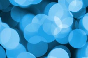 Blue Festive Christmas elegant abstract background with many bokeh lights. Defocused artistic image photo