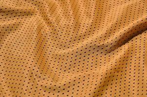 Texture of sportswear made of polyester fiber. Outerwear for sports training has a mesh texture of stretchable nylon fabric photo