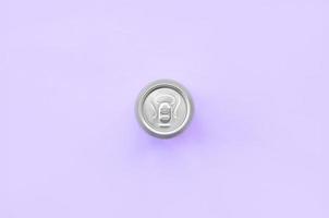 Metallic beer can on texture background of fashion pastel violet color paper in minimal concept photo