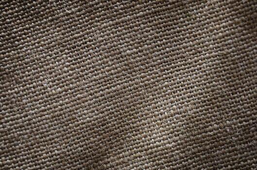 The texture of a very old brown sack cloth. Retro texture with canvas material. Background image with copy space photo