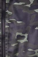 Texture of fabric with a camouflage painted in colors of the marsh. Army background image photo