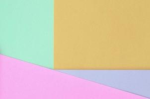 Texture background of fashion pastel colors. Pink, violet, orange and blue geometric pattern papers. photo