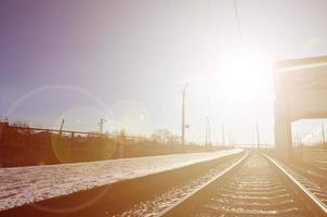 Empty railway station platform photo