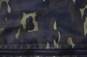 Textile pattern of military camouflage fabric photo