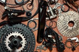 Many different metal parts and components of the running gear of a sports bike photo